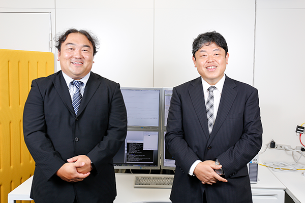 NECソリューションイノベータ株式会社 イノベーション戦略本部 セキュリティ戦略室／市川大輔（左）、北陸支社 セキュリティグループ（イノベーション戦略本部 セキュリティ戦略室兼務）／高江茂（右）